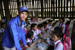 a WFP staff with school children