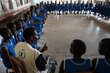 Joyce, WFP Programme Associate, talks to girls at the Kangole Girls Primary School in Kangole, Karamoja, Uganda on July 20, 2023.  WFP/Arete/Siegfried Modola