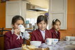 Girls take lunch at a school in Tajikistan