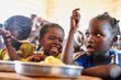 Primary school children in Paoua, CAR, eat WFP supplied by local farmers. WFP Richard Mbouet