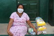 Photo: WFP/Miller Choles, Woman receiving food from the WFP for their children who study at the Divina Pastora Educational Institution in Riohacha, La Guajira, Colombia.