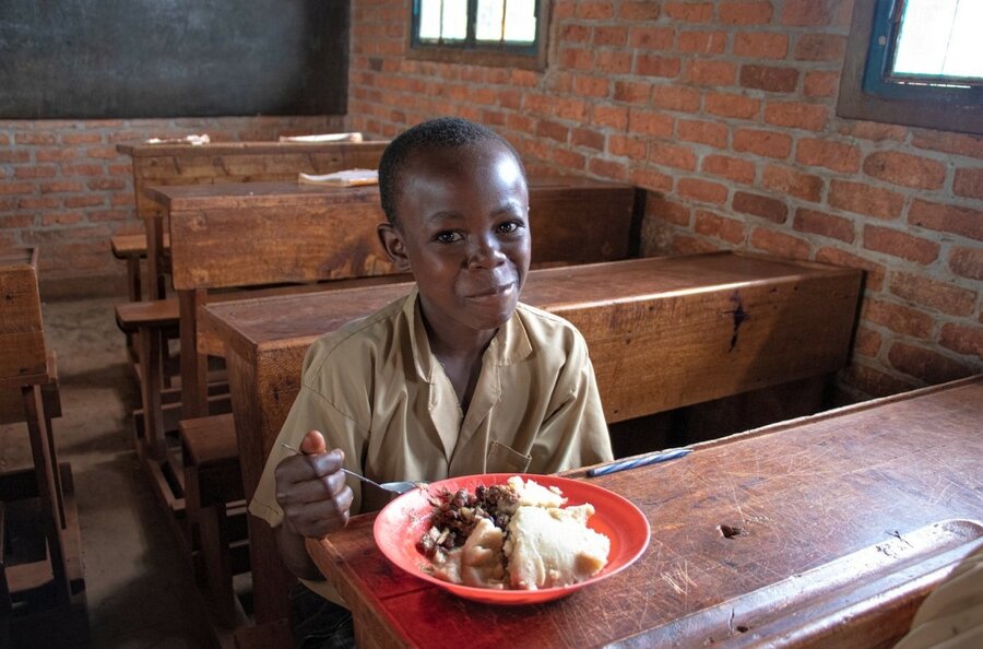Niyibizi Hamidal,14, enjoys a WFP hot nutritious meal in class. Photo: WFP/Aurore Ishimwe