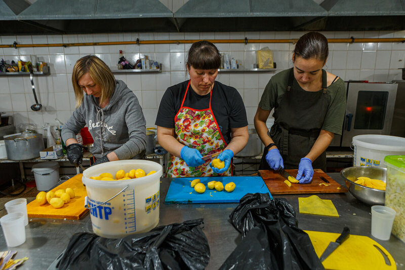 Volunteers preparing sandwiches in Uzhorod in a n