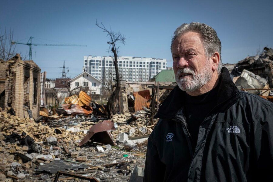 WFP Executive Director David Beasley surveys the damage in Bucha, Ukraine, during a visit last year. Photo: WFP/Marco Frattini