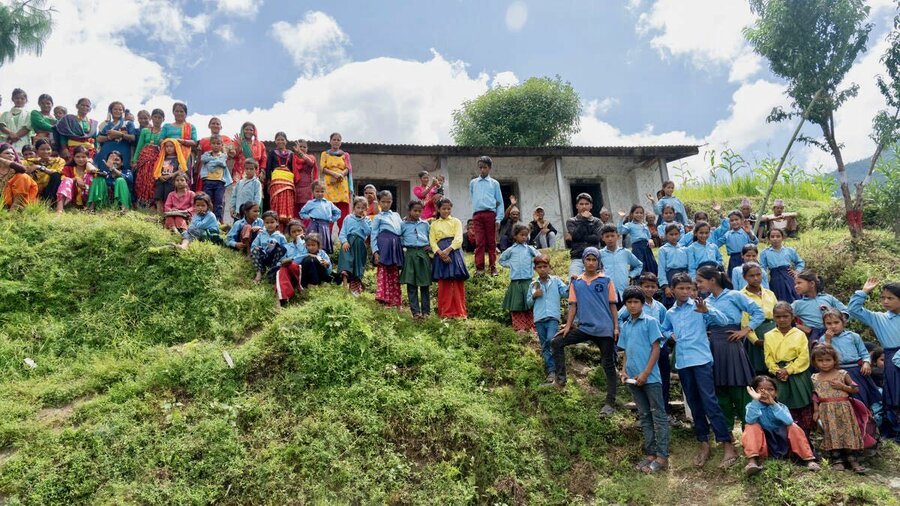 School staff and families gather to watch the football match at Ganesh primary school on a Friday afternoon. Photo: WFP/Srawan Shrestha