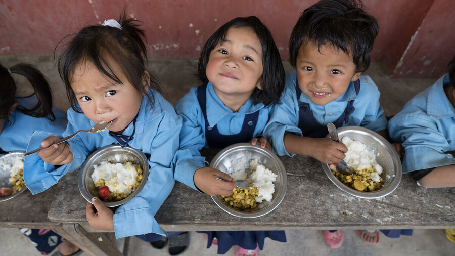 Ganesh primary school children in Nepal enjoy a hearty lunch, with the raw ingredients supplied by local farmers. Photo: WFP/Srawan Shrestha