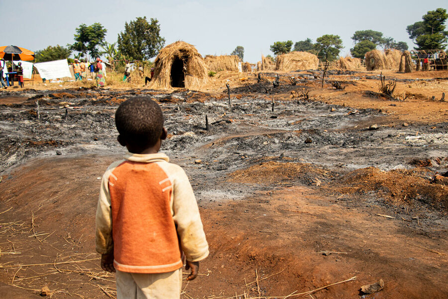 A boy gazes at the fire-wrought damage of a camp for conflict-displaced people in South Kivu province, DRC, where WFP provides food assistance.  Photo: WFP/Michael Castofas