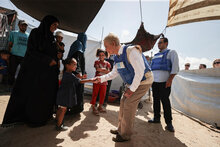 WFP/Ali Jadallah. During her visit to Gaza the Executive Director was introduced to Maisaa’s family and she spoke to them in their makeshift tent. Maisaa’s child is severely malnourished and has been receiving support for several months from WFP’s partner ACF.
