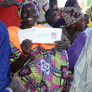 Woman receiving cash assistance in Mali